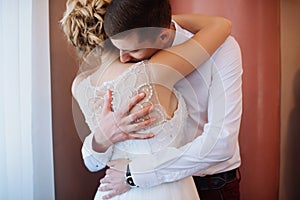 Female and male portrait. Lady and guy outdoors.Wedding couple in love, close-up portrait of young and happy bride and groom at we