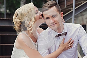 Female and male portrait. Lady and guy outdoors.Wedding couple in love, close-up portrait of young and happy bride and groom at we