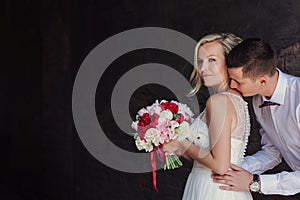Female and male portrait. Lady and guy outdoors.Wedding couple in love, close-up portrait of young and happy bride and groom at we