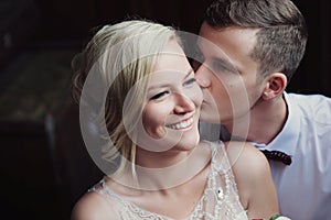 Female and male portrait. Lady and guy outdoors.Wedding couple in love, close-up portrait of young and happy bride and groom at we