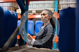 Female manager checking stocks in warehouse