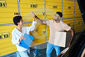 Female manager greets the client at the storage warehouse