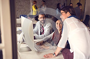 Female manager looking working task on computer in office