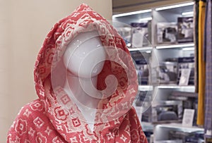 Female mannequin in a clothing store. Trading equipment - female plastic dummy