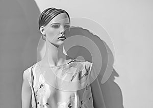 Female mannequin in a clothing store. Trading equipment - female plastic dummy