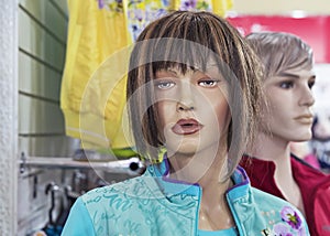 Female mannequin in a clothing store. Trading equipment - female plastic dummy