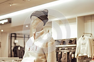 Female mannequin dressed in a street style clothes in store
