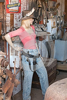 Female mannequin in an old garage