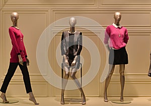 Female mannequins in a fashion clothing shop window