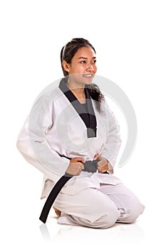 Female martial art fighter kneel down and smile, full body portrait