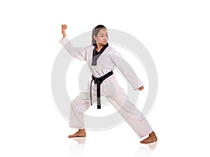 Female martial art fighter striking a pose, full length portrait, white background