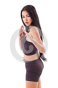 Female martial artist assuming kungfu fighting stance photo