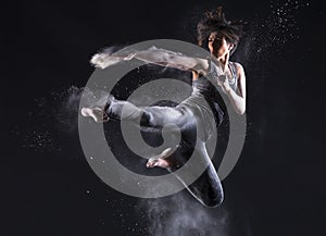 Female Martial Artist with Powder Jump Kick photo