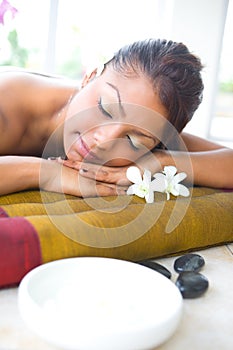 Female on massage bed with aromatherapy bowl