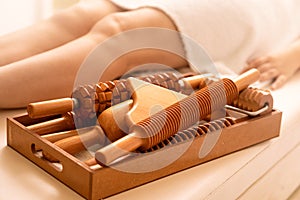 On the massage table is a tool for ant cellulite massage of Madero therapy photo