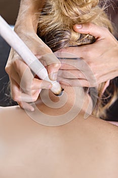A female massage therapist doing a massage