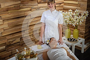 Female masseur give beauty treatment luxury spa photo