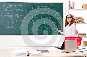 The female math teacher in the classroom