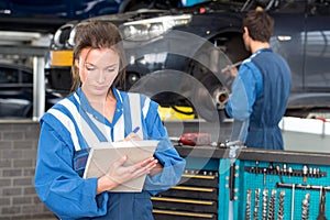 Female mechanic during a MOT test photo