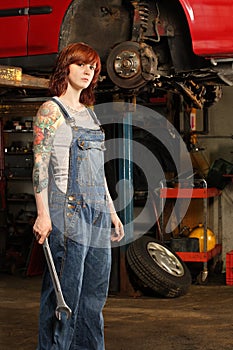 Female mechanic with tattoos