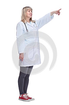 female medic in a white coat looking at you .