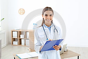 Female medical assistant working in clinic