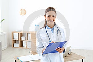 Female medical assistant working in clinic photo