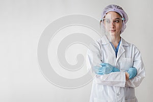 Female medical doctor wearing face shield on white background