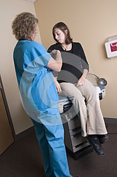 Female medical professional with pregnant woman