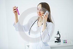 Female medical or research scientist or doctor using looking at