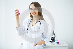 Female medical or research scientist or doctor using looking at