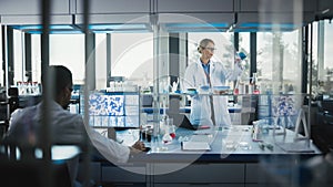 Female Medical Scientist Wearing White Coat and Safety Glasses uses Micropipette while Examining T