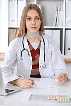 Female medicine doctor hand hold clipboard pad and give prescription to patient closeup. Panacea and life save