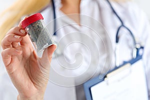 Female medicine doctor hand hold medical marijuana