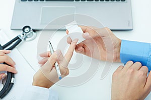 Female medicine doctor hands hold jar of pills and explain the patient how to use daily dose of pills.