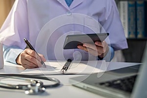 Female medicine doctor, physician or practitioner in lab room writing.