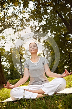 Female meditate in lotus pose