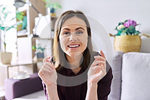 Female mentor, tutor, teacher looking at webcam, closeup face