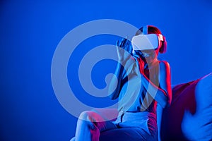 Female in metaverse sitting excited and emotionally watch movie. Hallucination.