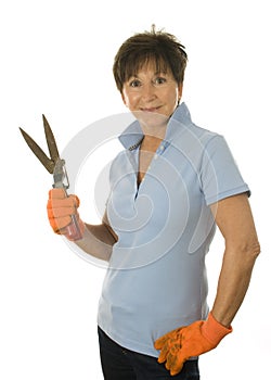 Female middle age woman gardener grass clippers