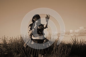 A female militia soldier in a post apocalyptic desert wasteland. photo