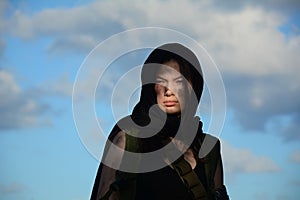 A female militia soldier in a post apocalyptic desert wasteland photo