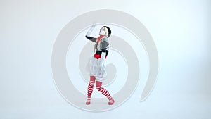 Female mime artist dancing gesturing having fun alone on white background