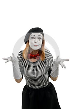 Female mime is confused. Vertical portrait, isolated on white