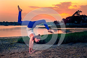 Female Model Adho Mukha Vrksasana Variation Handstand Beach