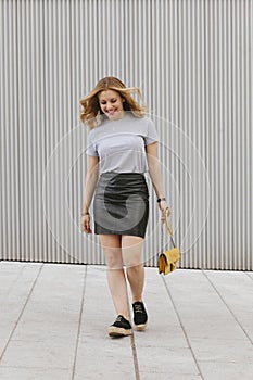 Female model with casual clothes walking on the street