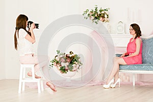 Female model and photographer in a photoshooting
