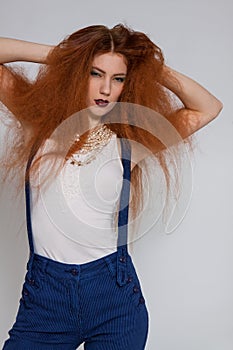 Female model playing with frizzy hair