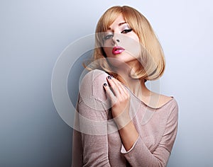 female model posing with blond short hair style