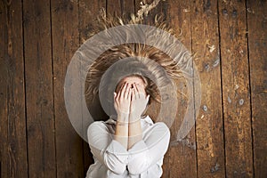 female model posing on wood floor